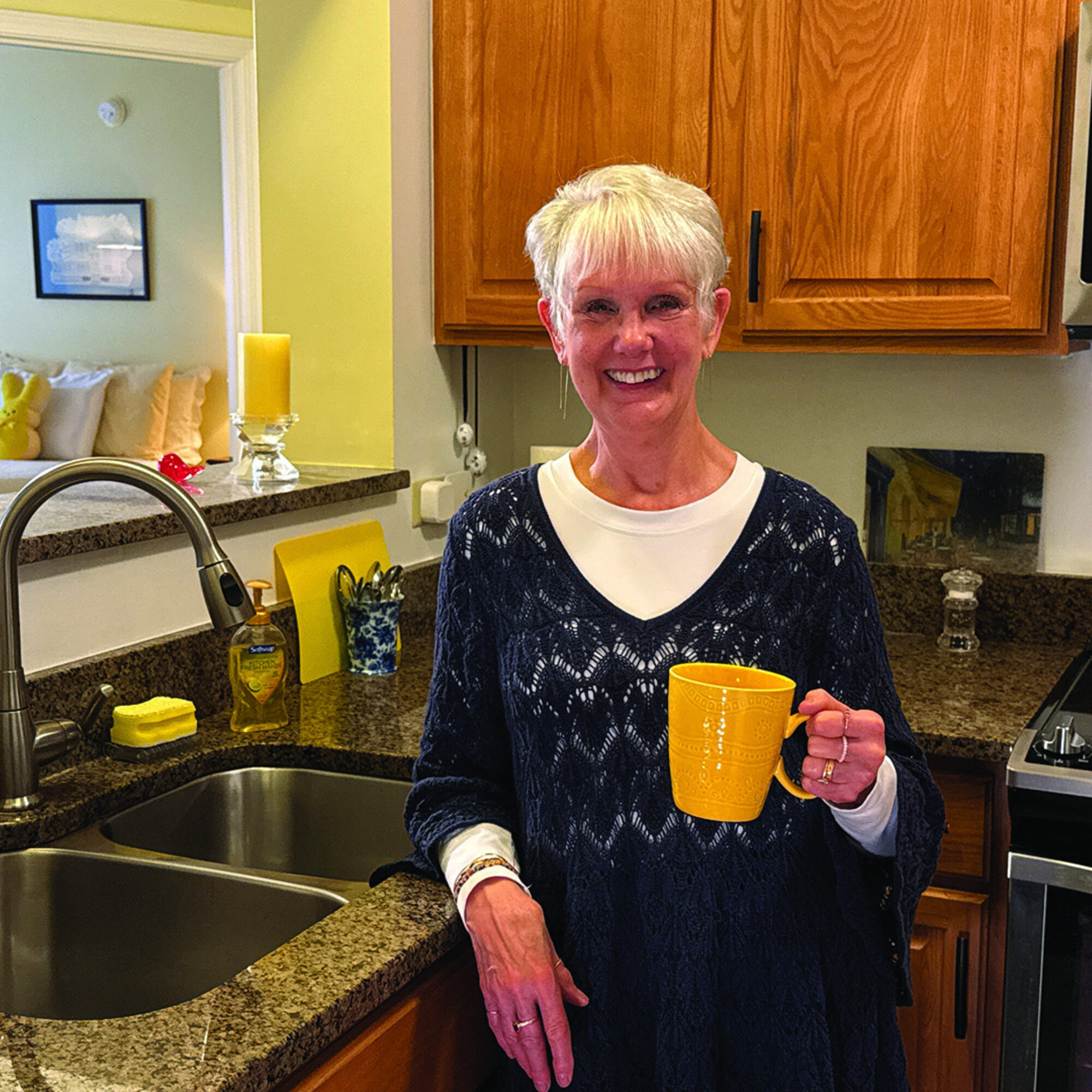 Smith Village resident in her independent living apartment kitchen