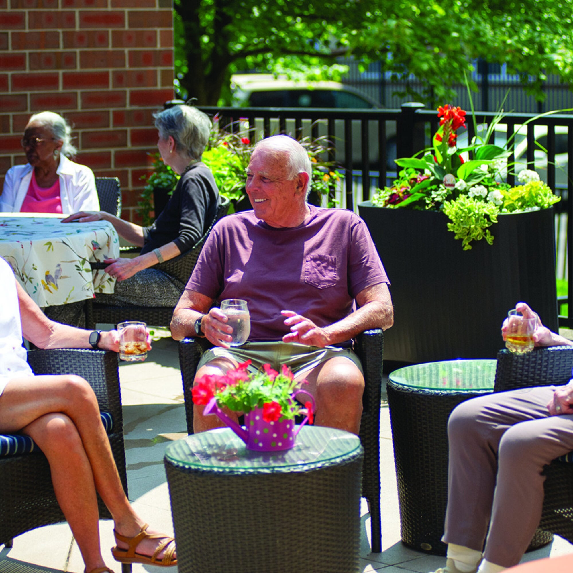Enjoying drinks with friends on the patio at Smith Village